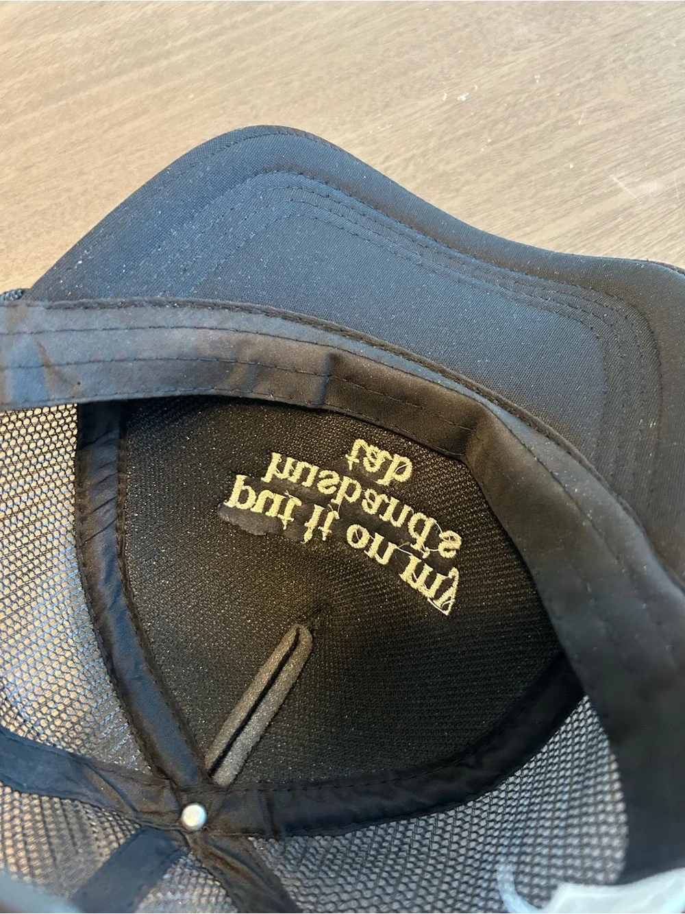 Black Trucker Cap with 'put it on my husband's tab' Embroidery